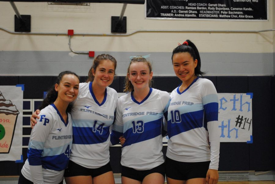 (From left to right) Seniors Melissa Grande, Libby Penn, Courtney Johnson, and Chloe Chanren pose for a picture before their last match of the season. 