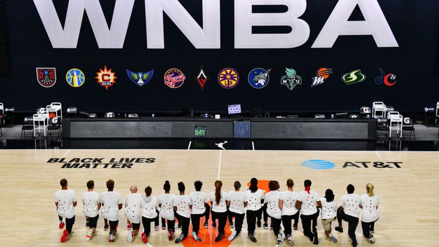 WNBA players kneel during the National Anthem to protest police brutality against African Americans in America