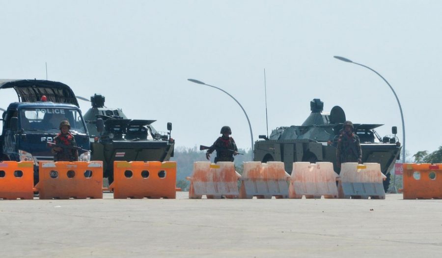 Soldiers guard a blocked road near Myanmars parliment in Naypyidaw on February 1
