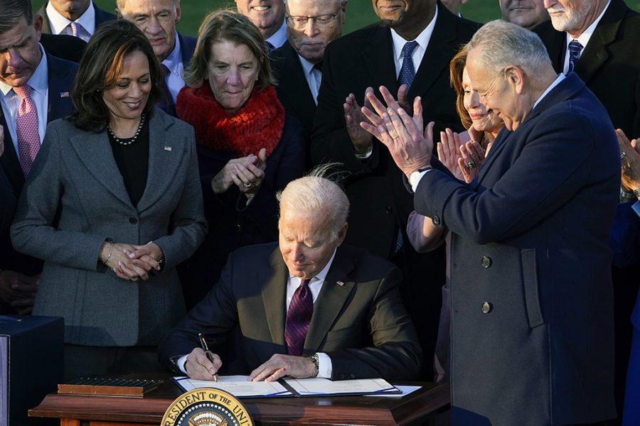 President Joe Biden signs the $1.2 trillion bipartisan infrastructure bill into law during a ceremony on the South Lawn of the White House in Washington, Monday, Nov. 15, 2021.